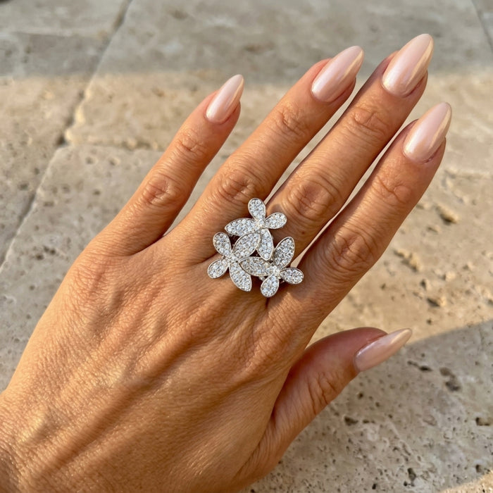 Hand wearing a diamond ring on a stone surface  Mariposa Pave Statement Ring - The Songbird Collection