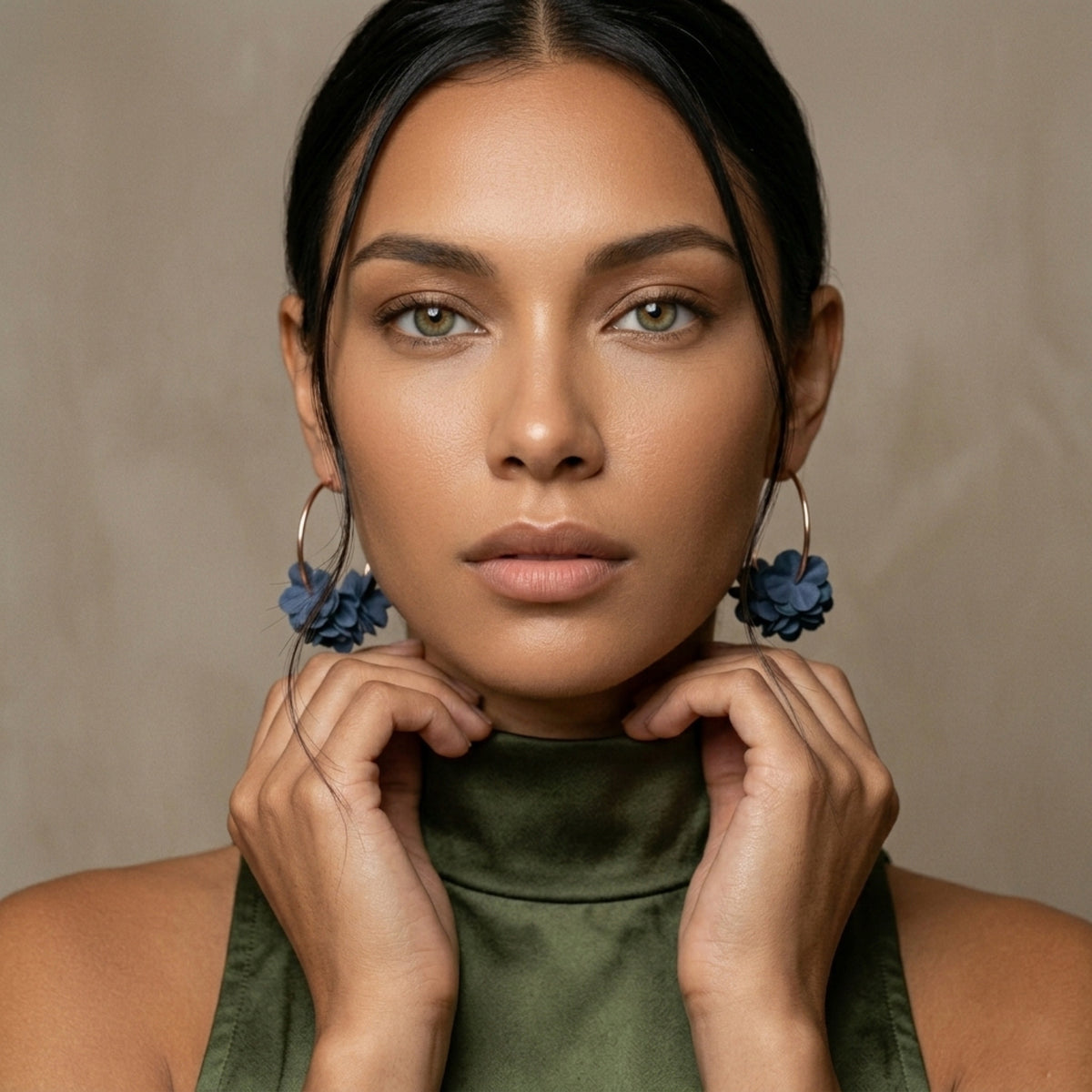 Woman wearing large hoop earrings with floral accents against a neutral background. Anielle Flower Hoops Earrings - The Songbird Collection I