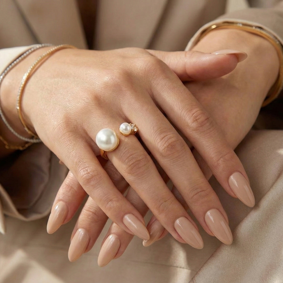Hand wearing a pearl ring with a neutral background - Arista Open Pearl Ring - stainless steel - The Songbird Collection