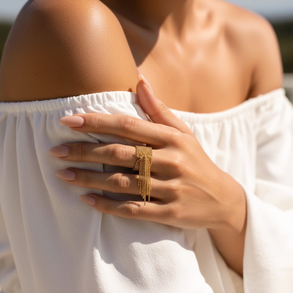 Close-up of a hand wearing a gold ring with a blurred background Beaded Fringe Statement Ring - The Songbird Collection