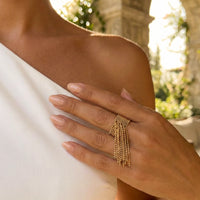 Gold fringe ring on a hand with a  blurred outdoor background Beaded Fringe Statement Ring - The Songbird Collection