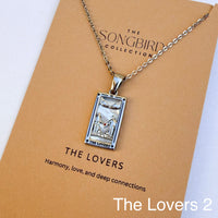 Necklace with a pendant labeled 'The Lovers' on a 'The Songbird Collection' card.
