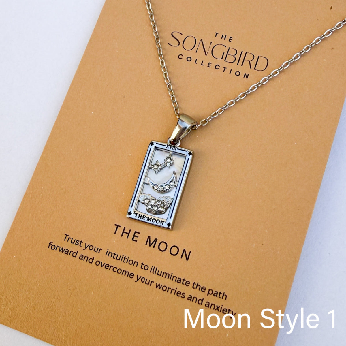 Necklace with tarot card pendant on a 'The Songbird Collection' card