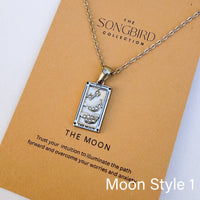 Necklace with tarot card pendant on a 'The Songbird Collection' card