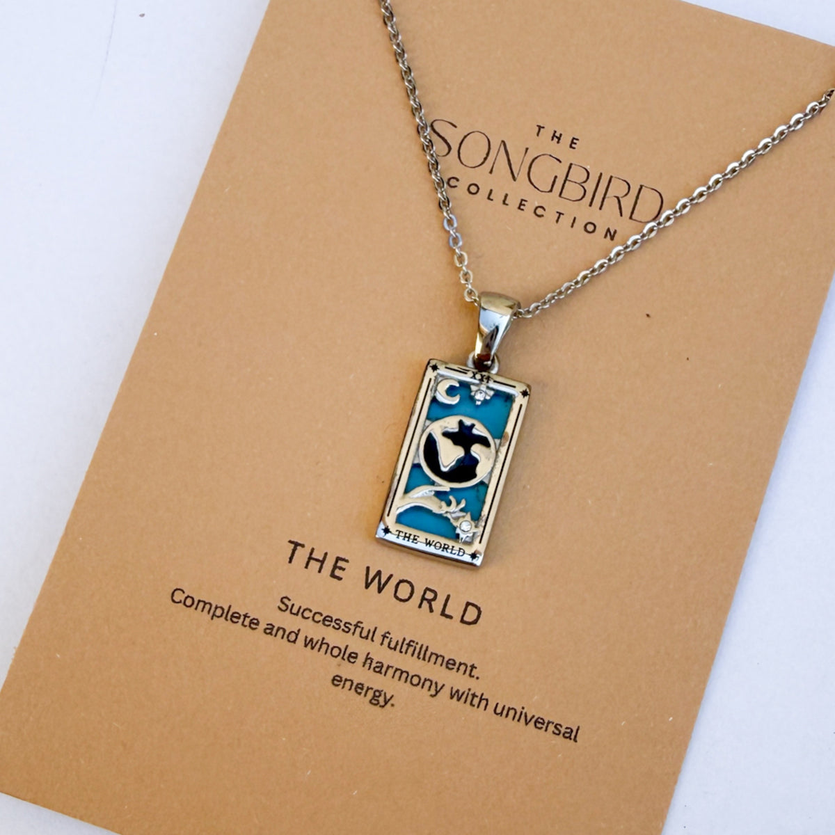 Necklace with tarot card pendant on a 'The Songbird Collection' card