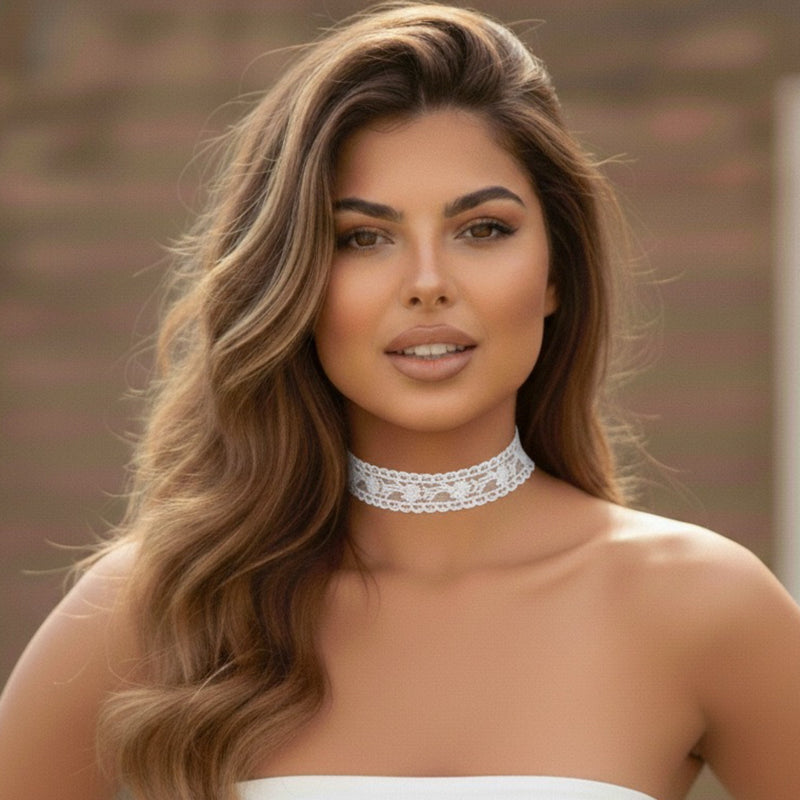 Woman wearing a white lace choker with a blurred background