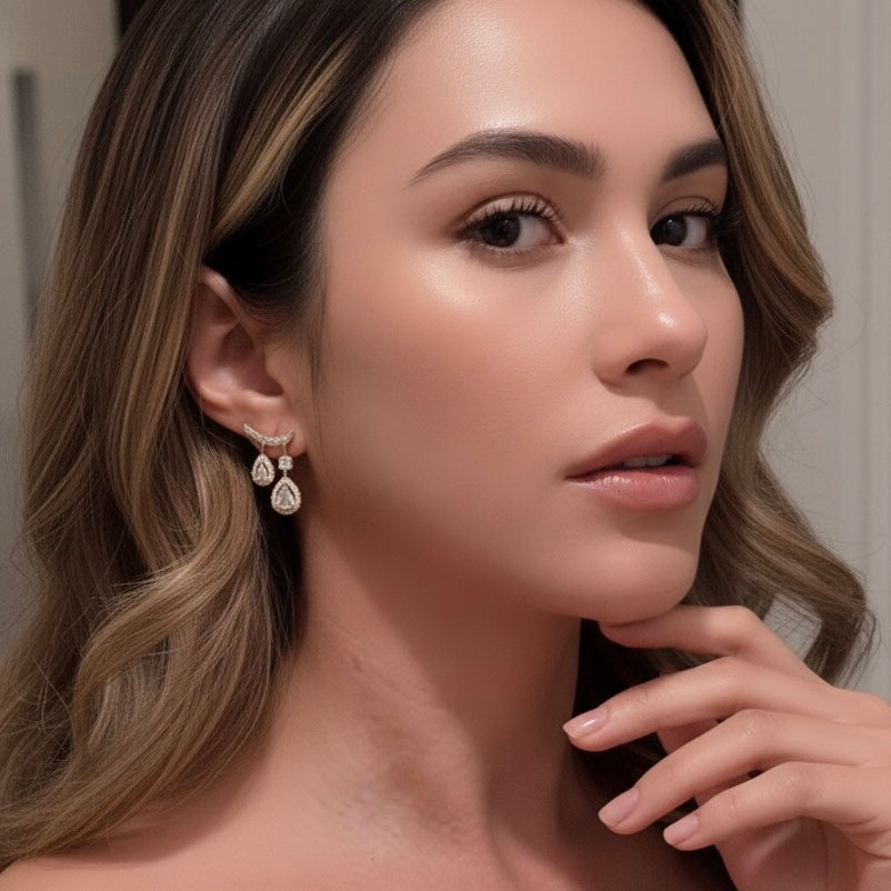 Close-up of a woman wearing earrings with a neutral background