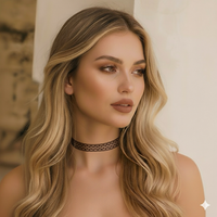 Woman wearing a black polka dot choker with a neutral background