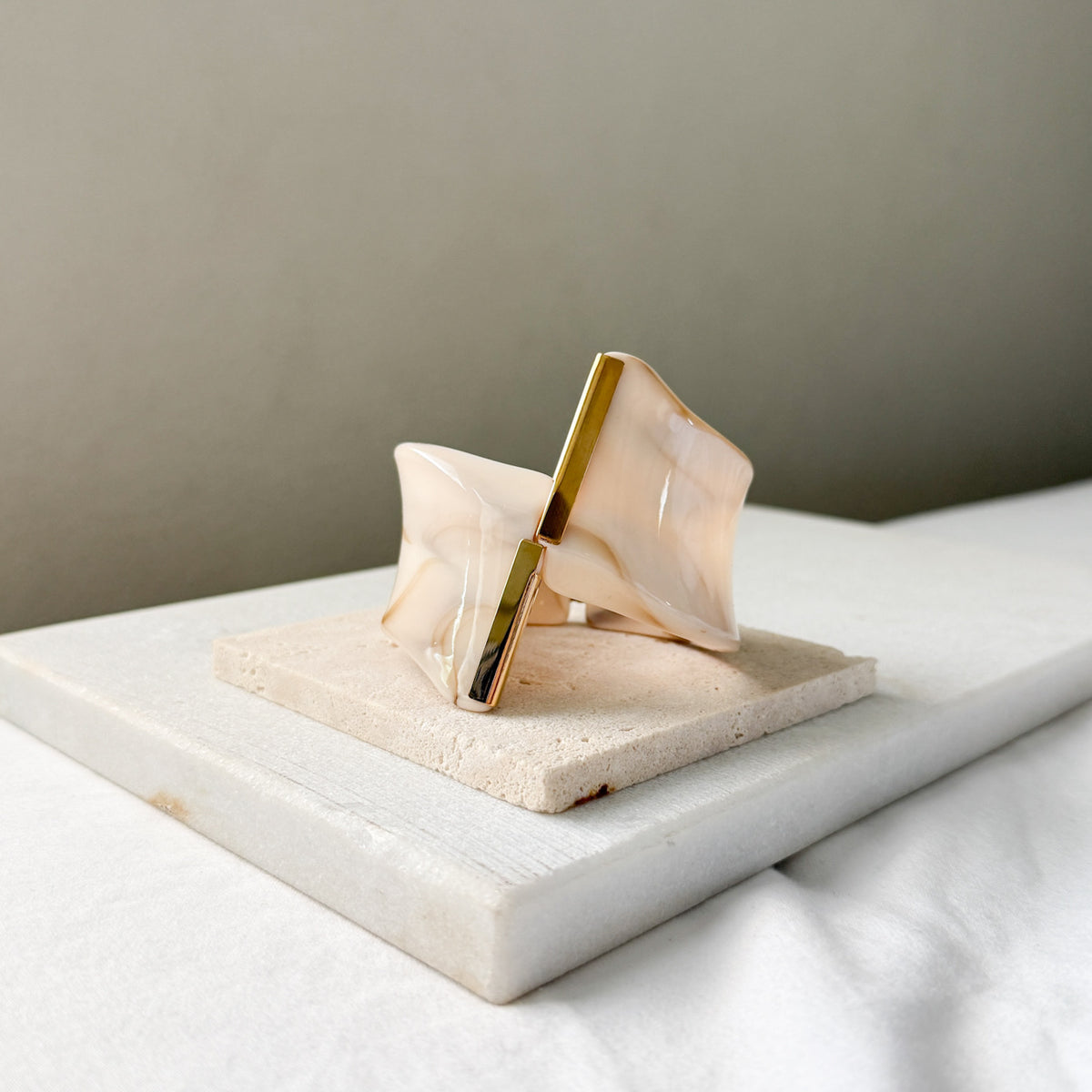 Decorative object with gold accents on a marble surface