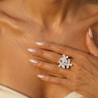 Close-up of a hand wearing a diamond ring on a beige background Mariposa Pave Statement Ring - The Songbird Collection