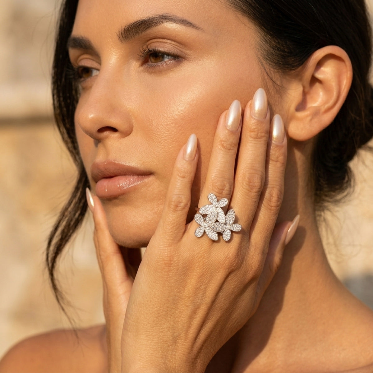 Woman wearing a diamond ring with a blurred background  Mariposa Pave Statement Ring - The Songbird Collection