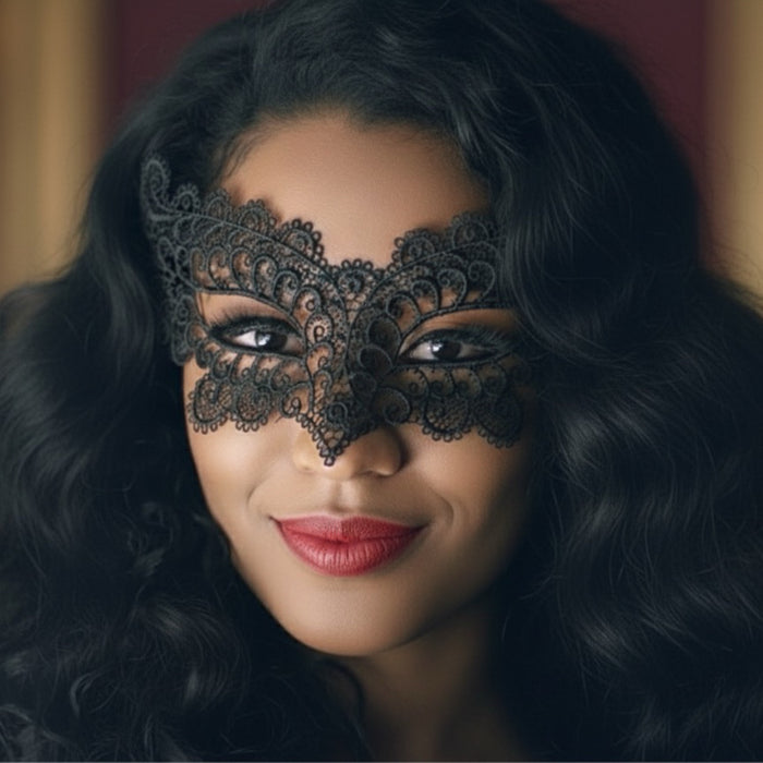 Woman wearing a black lace mask with dark hair and red lipstick.