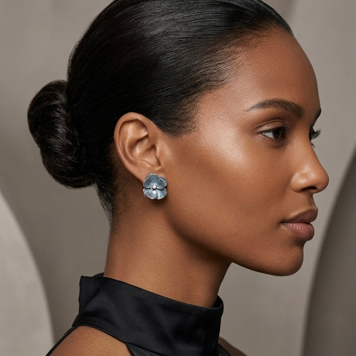 Woman wearing blue floral earrings with a neutral background - Moonlit Peony Earrings - The Songbird Collection