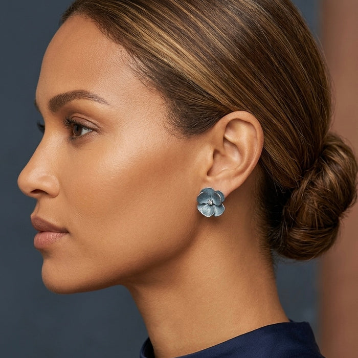 Woman wearing a floral earring with a blurred background