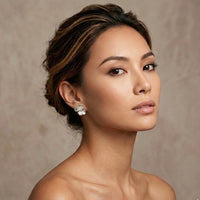 Woman wearing earrings against a neutral background - Moonlit Petals Earrings - The Songbird Collection