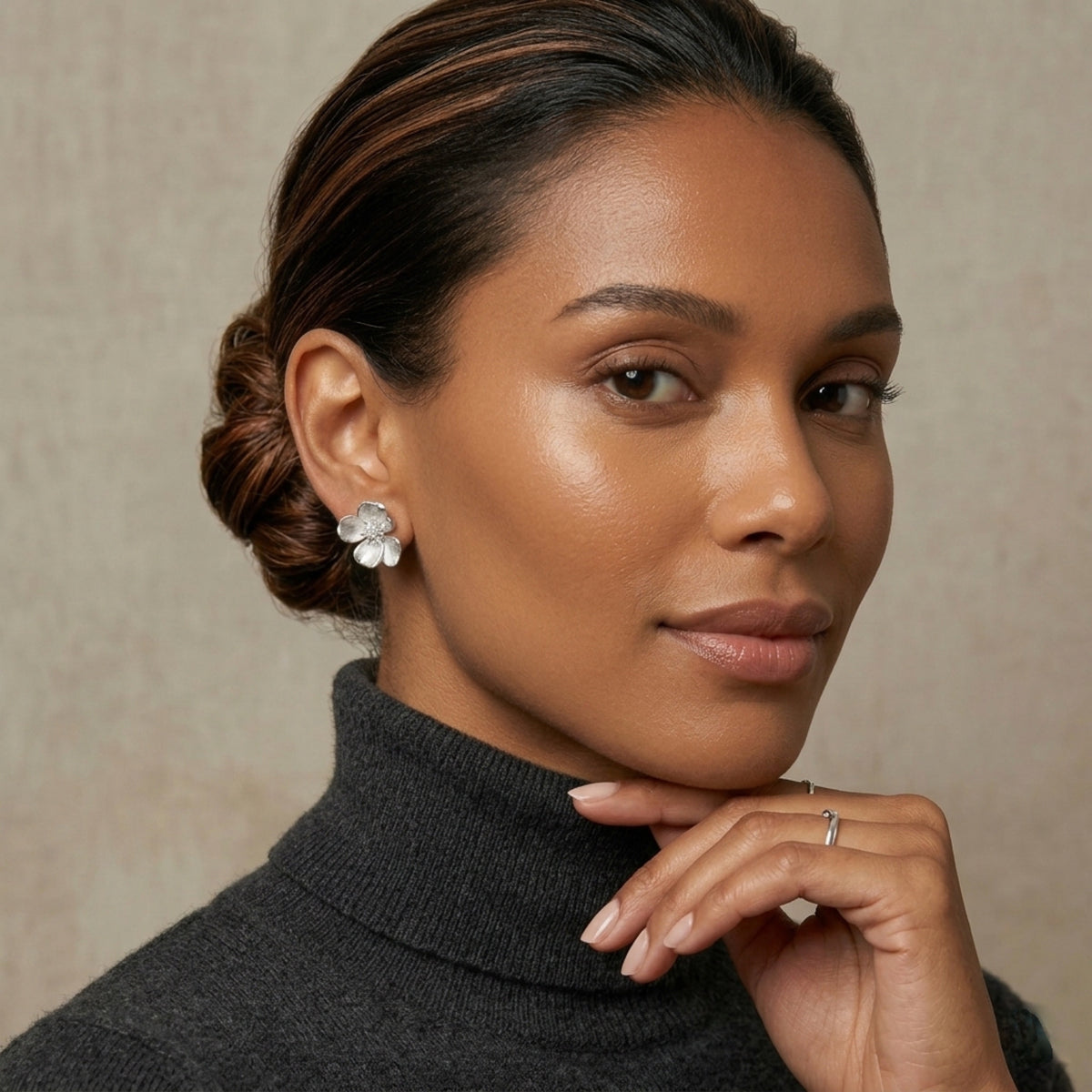 Woman wearing a dark gray turtleneck sweater with a neutral background Moonlit Petals Earrings - The Songbird Collection