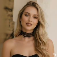 Woman wearing a black lace choker with a neutral background