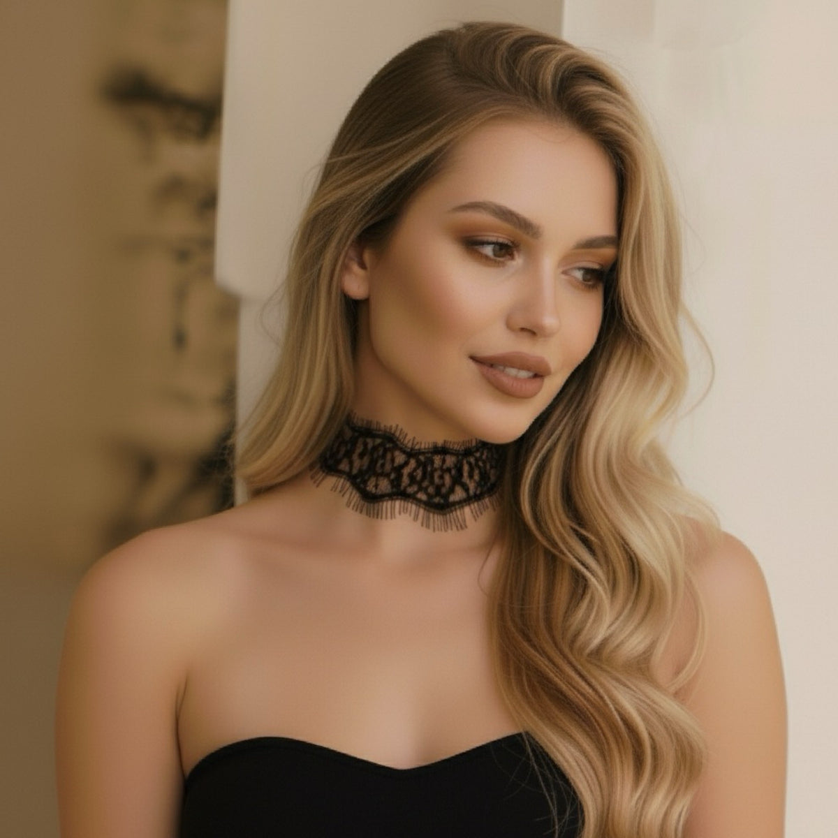 Woman wearing a black lace choker necklace against a neutral background