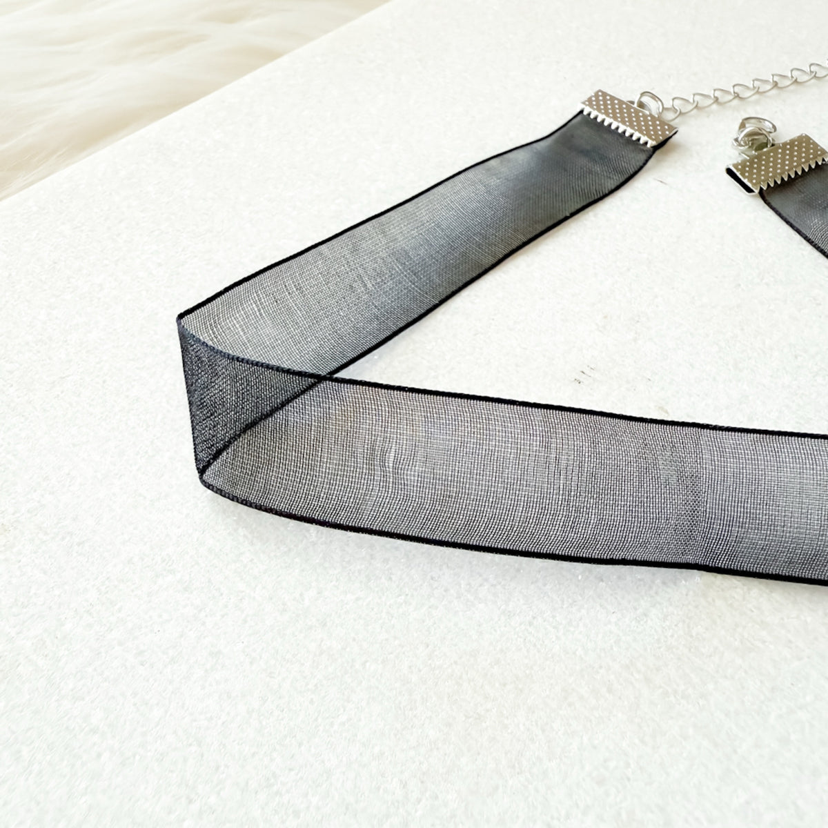 Black mesh ribbon on a white background