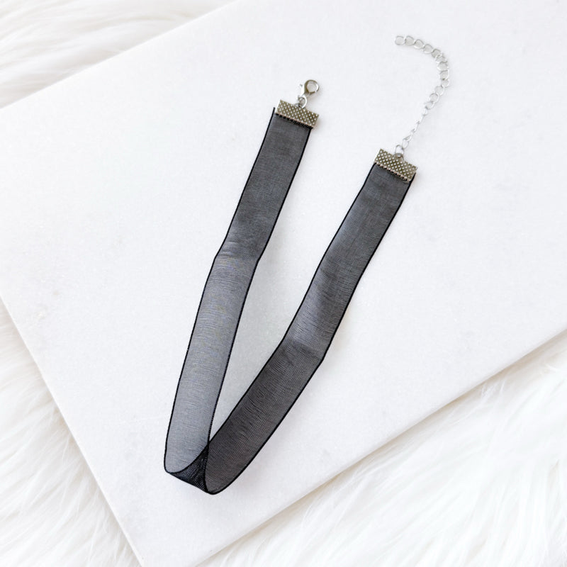 Black sheer ribbon necklace choker on a white background