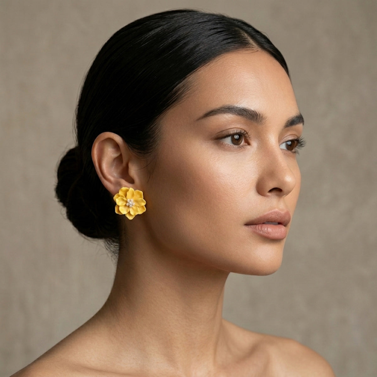 Woman wearing yellow floral earrings against a neutral background.Rosalie Earrings - The Songbird Collection