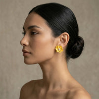 Woman wearing a yellow floral earring against a neutral background. Rosalie Earrings - The Songbird Collection
