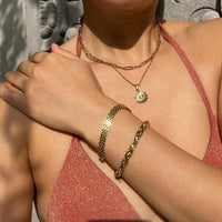 Roshanee eye sun ray necklace stainless steel gold plating the songbird collection
