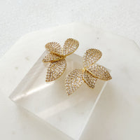 Gold butterfly-shaped earrings on a white surface Seraphine Earrings - The Songbird Collection - pave - floral petal
