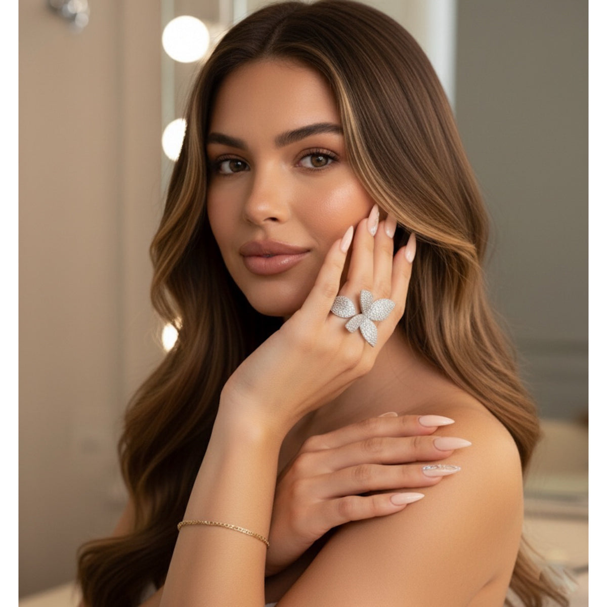 Woman wearing a petal/flora/butterfly-shaped wrap around ring 