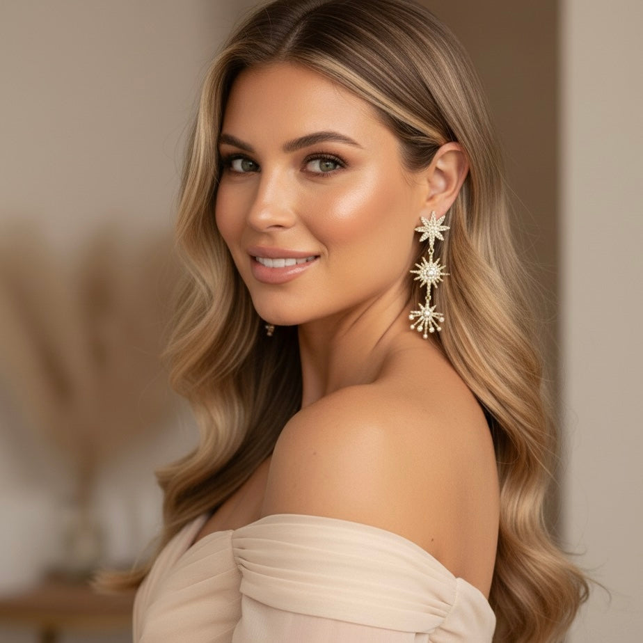Woman wearing star-shaped earrings with a blurred background