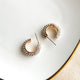 Clear stones on gold